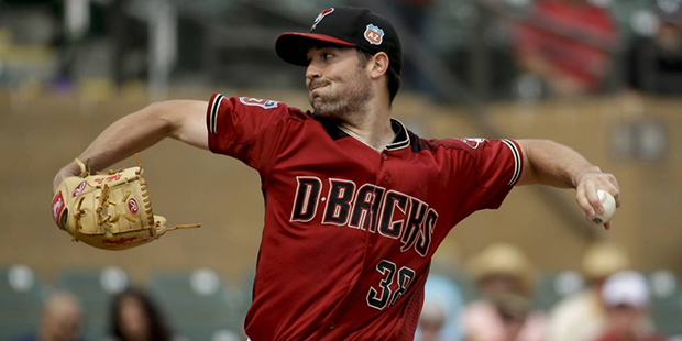 Arizona Diamondbacks starting pitcher Robbie Ray throws against the Colorado Rockies during the fir...