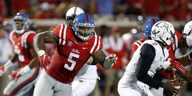 Mississippi defensive tackle Robert Nkemdiche (5) pursues Vanderbilt quarterback Johnny McCrary (2)...