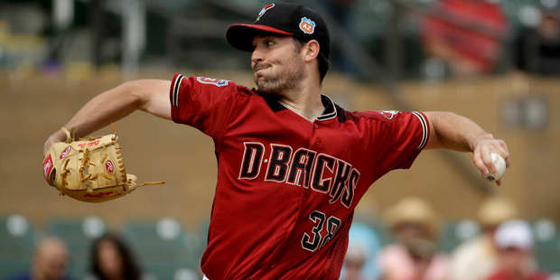 Arizona Diamondbacks starting pitcher Robbie Ray throws against the Colorado Rockies during the fir...