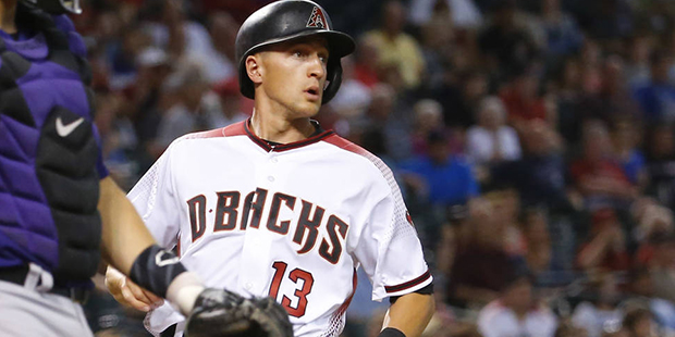 Arizona Diamondbacks' Nick Ahmed (13) scores on a ground out by David Peralta during the third inni...
