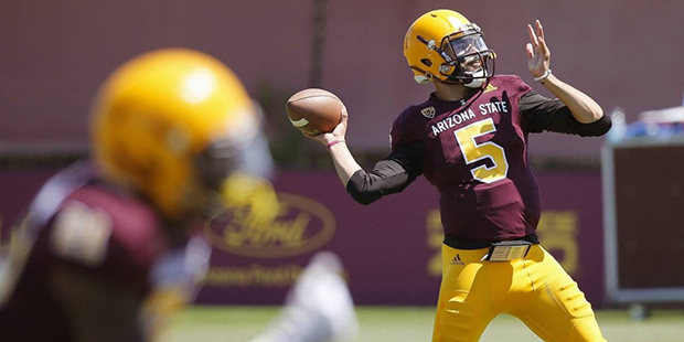 Arizona State quarterback Manny Wilkins throws a pass during a spring NCAA college football game Sa...