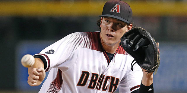 Arizona Diamondbacks' Peter O'Brien looks the ball into his glove on a grounder hit by Philadelphia...
