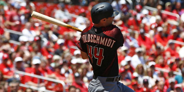 Arizona Diamondbacks' Paul Goldschmidt drives in Jean Segura (not pictured) during the first inning...