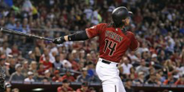 Arizona Diamondbacks' Peter O'Brien (14) watches the flight of his three-run home run as Miami Marl...