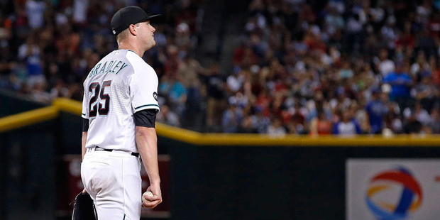 Arizona Diamondbacks' Archie Bradley walks back ontp the mound with a new baseball after giving up ...