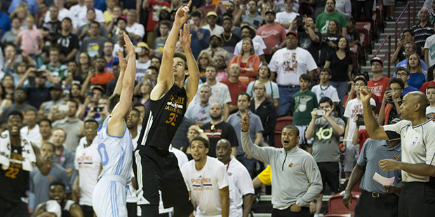 Phoenix Suns' Dragan Bender (35) gets fouled by Denver Nuggets’ Mateusz Ponitka (20) to send him ...