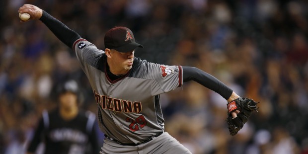 Arizona Diamondbacks relief pitcher Brad Ziegler throws a pitch to Colorado Rockies' Trevor Story i...