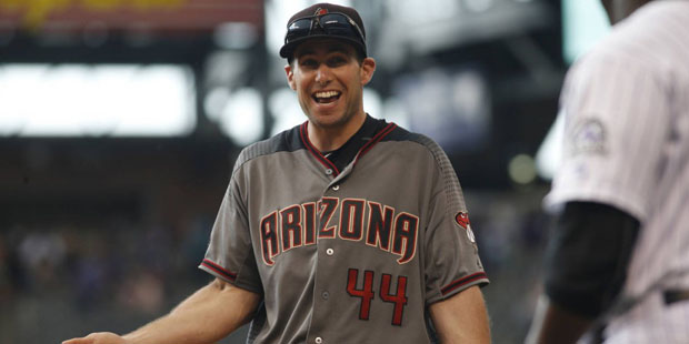 Arizona Diamondbacks first baseman Paul Goldschmidt (44) jokes with Colorado Rockies first base coa...