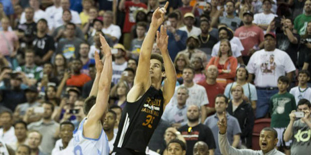 Phoenix Suns' Dragan Bender (35) gets fouled by Denver Nuggets' Mateusz Ponitka (20) to send him to...