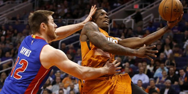 Phoenix Suns guard Eric Bledsoe, right, drives past Detroit Pistons forward Aron Baynes during the ...