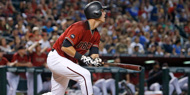 Arizona Diamondbacks' Jake Lamb watches the flight of his home run against the Los Angeles Dodgers ...