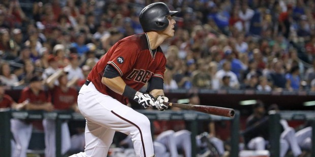 Arizona Diamondbacks' Jake Lamb watches the flight of his home run against the Los Angeles Dodgers ...