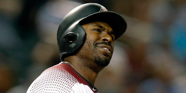Arizona Diamondbacks Michael Bourn reacts after striking out against Washington Nationals Stephen S...