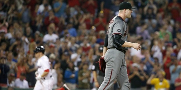 Arizona Diamondbacks' Archie Bradley walks on the mound after giving up a two-run home run to Bosto...