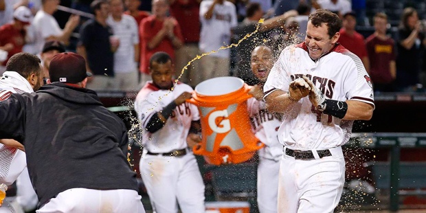 Arizona Diamondbacks' Paul Goldschmidt arrives at home plate as the team celebrates his walk off ho...