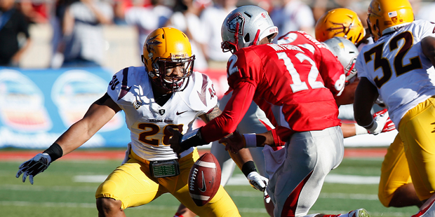 New Mexico's Clayton Mitchem (12) fumbles the ball in front of Arizona State's Viliami Moeakiola (2...