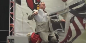 Down goes Wolf! Larry Fitzgerald tackles Ron Wolfley at Cardinals training camp