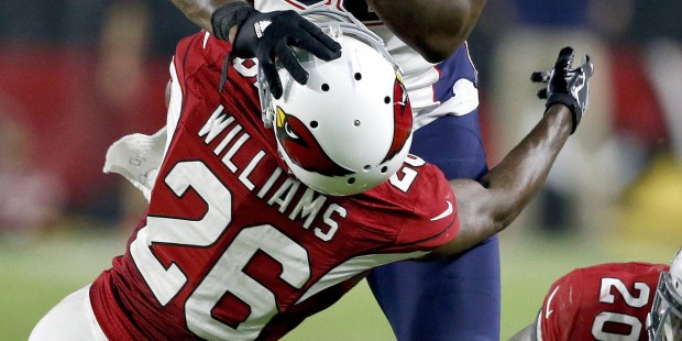 New England Patriots tight end Martellus Bennett (88) hits Arizona Cardinals cornerback Brandon Wil...
