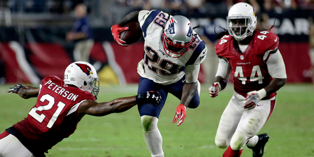 New England Patriots running back LeGarrette Blount (29) is hit by Arizona Cardinals cornerback Pat...