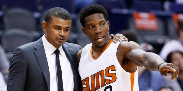 Phoenix Suns' Eric Bledsoe (2) talks with head coach Earl Watson during the first half of an NBA pr...