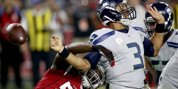 Arizona Cardinals outside linebacker Chandler Jones (55) forces Seattle Seahawks quarterback Russel...
