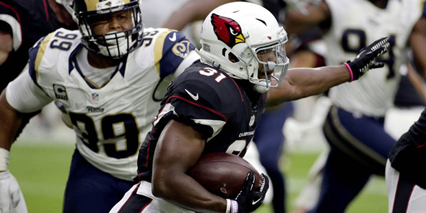 Arizona Cardinals running back David Johnson (31) runs as Los Angeles Rams defensive tackle Aaron D...