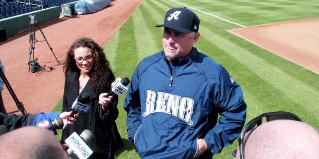 In this photo taken on Tuesday, April 1, 2014, snow flurries fall as Reno Aces manager Phil Nevin t...