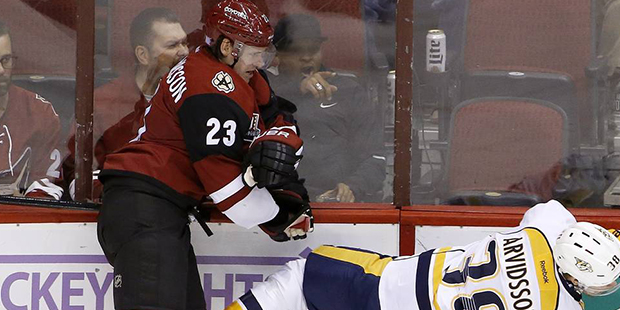 Arizona Coyotes defenseman Oliver Ekman-Larsson (23) checks Nashville Predators left wing Viktor Ar...