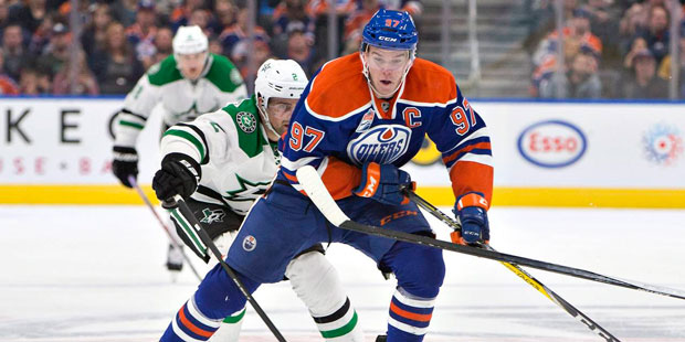 Dallas Stars' Dan Hamhuis (2) chases Edmonton Oilers' Connor McDavid (97) during the second period ...