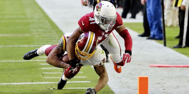 Arizona Cardinals cornerback Marcus Cooper (41) stops Washington Redskins wide receiver Ryan Grant ...