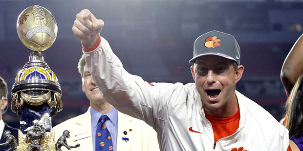 Clemson coach Dabo Swinney celebrates after the team's Fiesta Bowl NCAA college football playoff se...