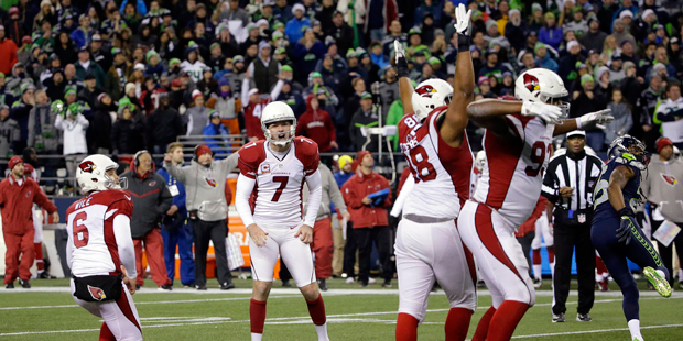 Arizona Cardinals kicker Chandler Catanzaro (7) reacts as teammates cheer after he kicked a winning...