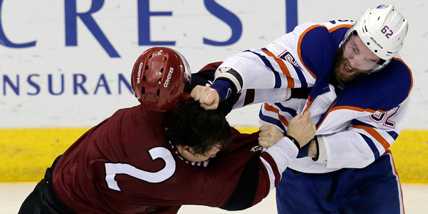 Arizona Coyotes defenseman Luke Schenn (2) and Edmonton Oilers defenseman Eric Gryba fight during t...
