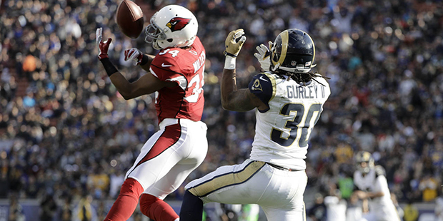 Arizona Cardinals cornerback Harlan Miller intercepts a pass intended for Los Angeles Rams running ...