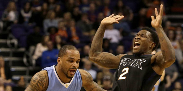 Phoenix Suns guard Eric Bledsoe (2) draws the offensive foul against Denver Nuggets guard Jameer Ne...