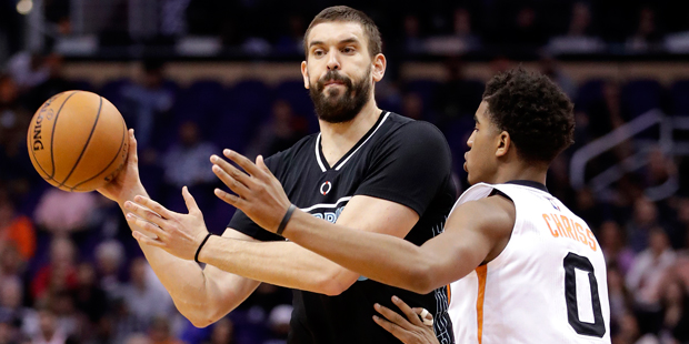 Memphis Grizzlies center Marc Gasol (33) passes around Phoenix Suns forward Marquese Chriss (0) dur...