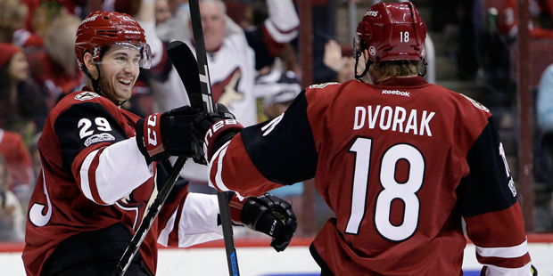 Arizona Coyotes left wing Brendan Perlini (29) celebrates with Christian Dvorak after scoring in th...
