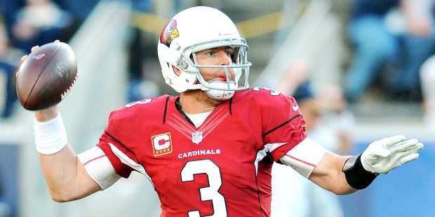 With blood in his mouth and on his chin strap Arizona Cardinals quarterback Carson Palmer (3) back ...