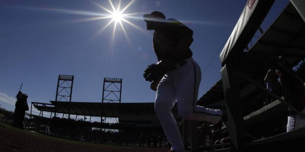 Members of the Arizona Diamondbacks take the field for a spring training baseball game against the ...