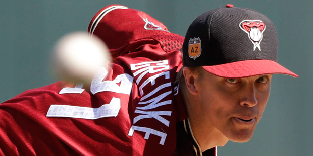 Arizona Diamondbacks' Zack Greinke throws during the first inning of an exhibition baseball game ag...