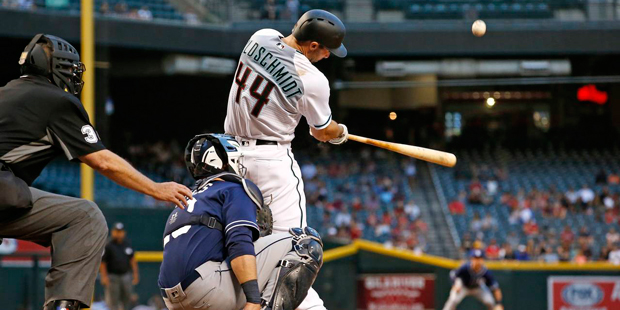 Arizona Diamondbacks' Paul Goldschmidt connects for a home run as San Diego Padres' Austin Hedges, ...