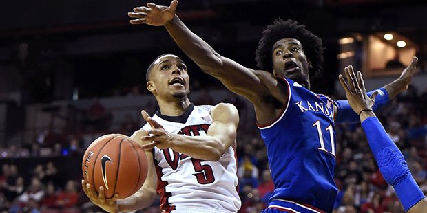 UNLV guard Jalen Poyser (5) shoots against Kansas guard Josh Jackson during the second half of an N...
