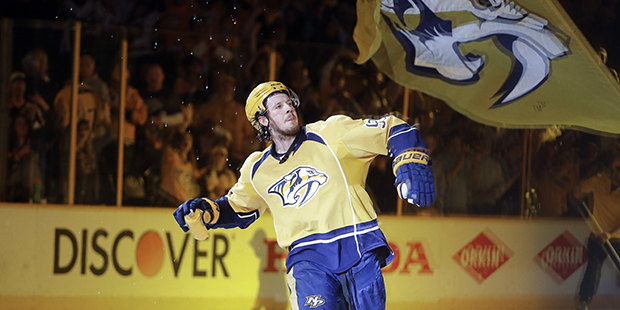Nashville Predators center Ryan Johansen throws a T-shirt into the crowd after as was introduced as...