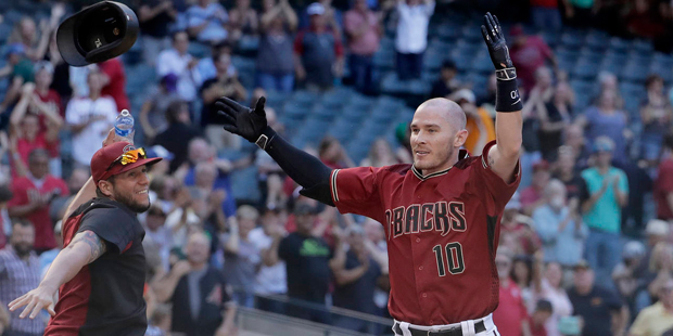 Arizona Diamondbacks' Chris Herrmann (10) celebrates his walk-off home run during the 11th inning o...