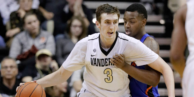 Vanderbilt forward Luke Kornet (3) drives against Florida forward Keith Stone in the second half of...