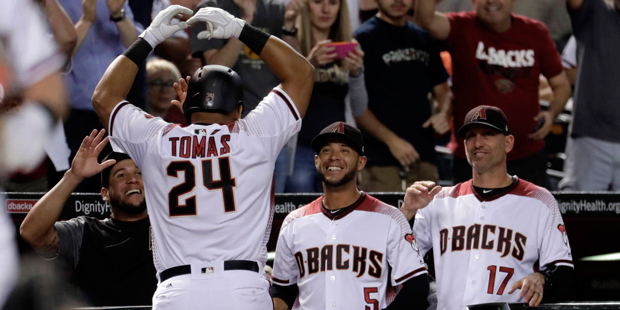 Arizona Diamondbacks Yasmany Tomas (24) celebrates after hitting a two RBI home run against the New...