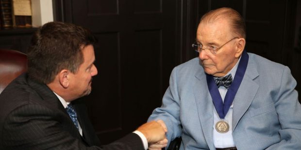 Cardinals owner Bill Bidwill is congratulated by son Michael at a ceremony on May 31, 2017 recogniz...