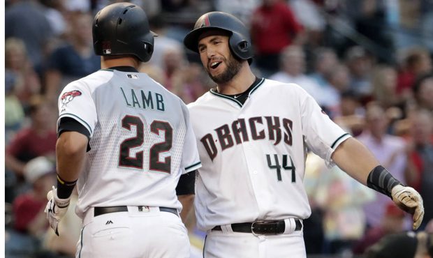Arizona Diamondbacks' Jake Lamb (22) greets teammate Paul Goldschmidt after hitting a two run home ...