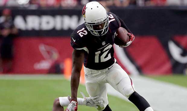 Arizona Cardinals wide receiver John Brown (12) escapes the tackle of Los Angeles Rams cornerback E...
