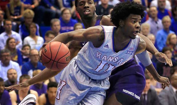 Kansas guard Josh Jackson (11) drives past TCU forward Karviar Shepherd (32) during the first half ...